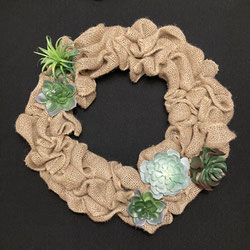 Burlap Wreath With succulents on black background